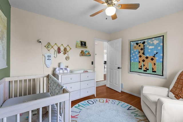 2708 94th Ave N, Brooklyn Park, MN 55444 - bedroom featuring wood finished floors, baseboards, and a ceiling fan