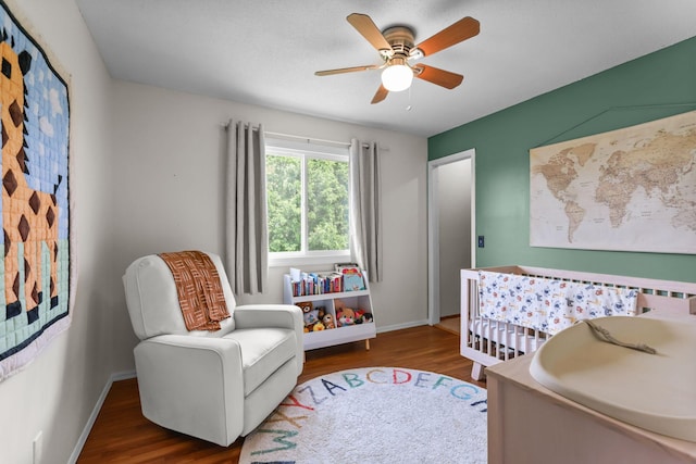 2708 94th Ave N, Brooklyn Park, MN 55444 - bedroom with wood finished floors, baseboards, and a ceiling fan