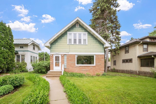 1027 Van Slyke Ave, Saint Paul, MN 55103 - view of front of home featuring a front lawn and brick siding