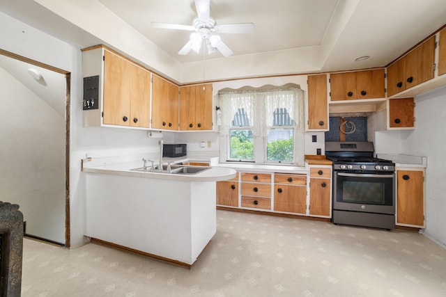 1027 Van Slyke Ave, Saint Paul, MN 55103 - kitchen with stainless steel range with gas cooktop, black microwave, light countertops, ceiling fan, and a sink