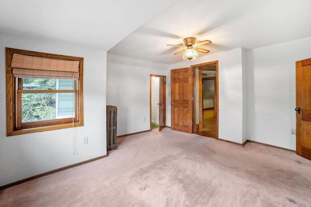 1027 Van Slyke Ave, Saint Paul, MN 55103 - unfurnished bedroom featuring light colored carpet, baseboards, and a ceiling fan