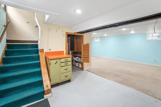 1027 Van Slyke Ave, Saint Paul, MN 55103 - basement featuring stairs, light colored carpet, and recessed lighting