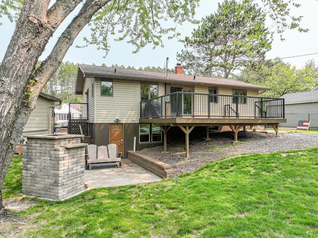 1424 Summit Ave, Cloquet, MN 55720 - rear view of house featuring a wooden deck, a chimney, a yard, stairs, and a patio area