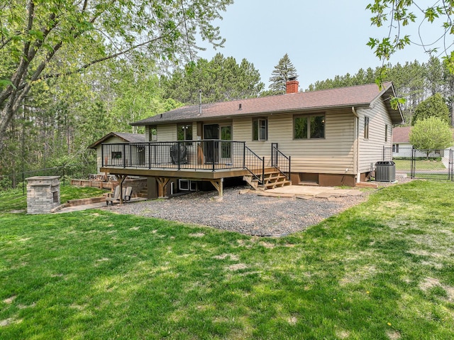 1424 Summit Ave, Cloquet, MN 55720 - back of house featuring a deck, a chimney, central AC, and a patio