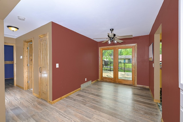 1424 Summit Ave, Cloquet, MN 55720 - empty room with wood finished floors, ceiling fan, baseboards, and a smoke detector