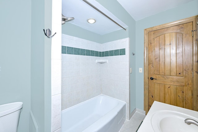 1424 Summit Ave, Cloquet, MN 55720 - full bathroom with tile patterned floors, toilet, shower / washtub combination, a sink, and baseboards
