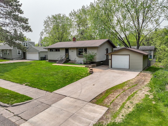 1424 Summit Ave, Cloquet, MN 55720 - view of front of house with a detached garage, an outdoor structure, driveway, entry steps, and a front lawn