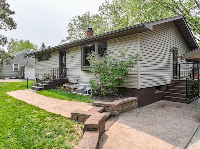 1424 Summit Ave, Cloquet, MN 55720 - view of front of house featuring a chimney and a front yard
