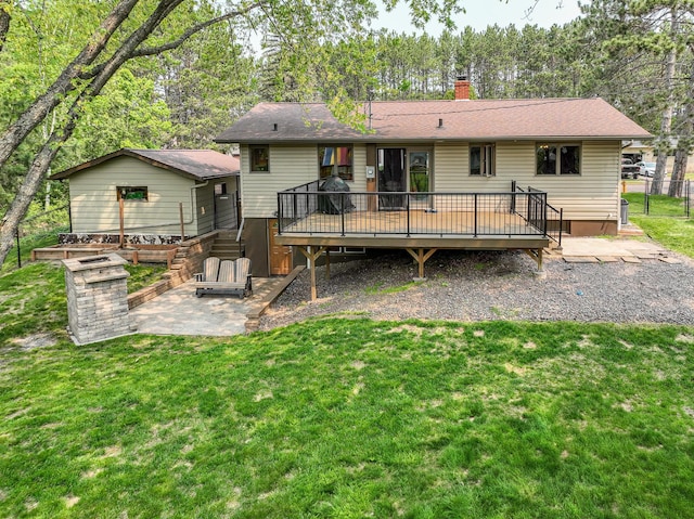 1424 Summit Ave, Cloquet, MN 55720 - rear view of house with a wooden deck, a patio, and a chimney