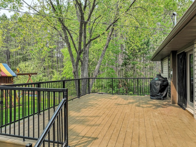 1424 Summit Ave, Cloquet, MN 55720 - deck featuring grilling area and a view of trees