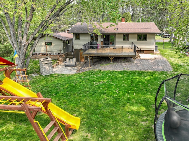 1424 Summit Ave, Cloquet, MN 55720 - back of property featuring a wooden deck, a playground, a chimney, and a patio