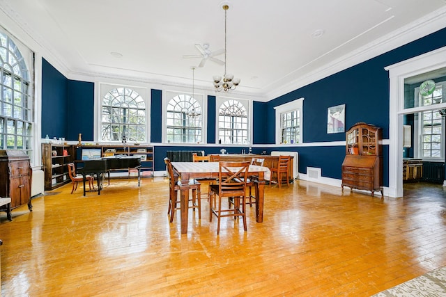 2306 5th St, Superior, WI 54880 - dining area featuring crown molding, wood-type flooring, and a chandelier