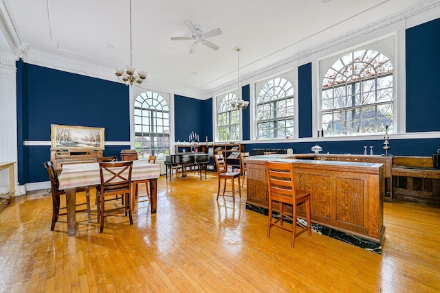 2306 5th St, Superior, WI 54880 - kitchen with a chandelier, light wood-style flooring, ceiling fan, crown molding, and decorative light fixtures