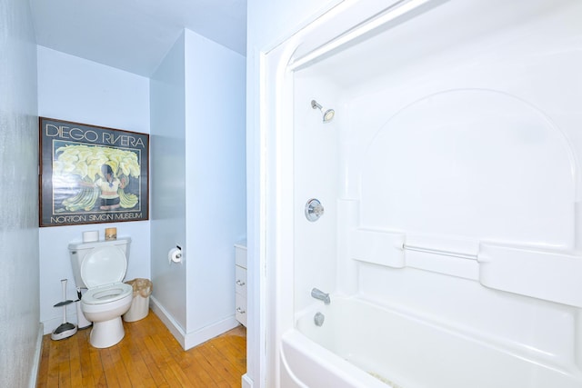 2306 5th St, Superior, WI 54880 - full bathroom featuring wood-type flooring, toilet, and shower / washtub combination