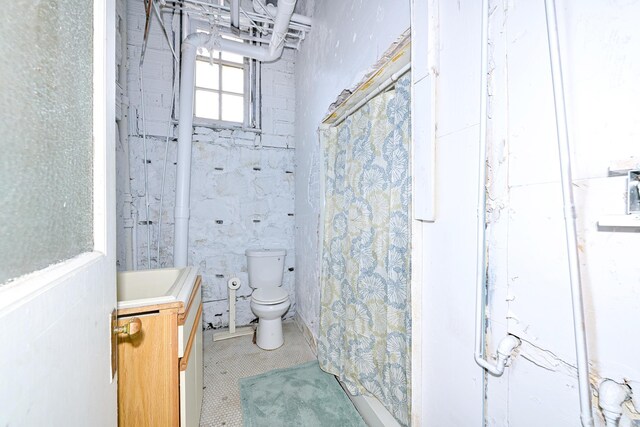 2306 5th St, Superior, WI 54880 - bathroom featuring toilet, vanity, and a shower with curtain