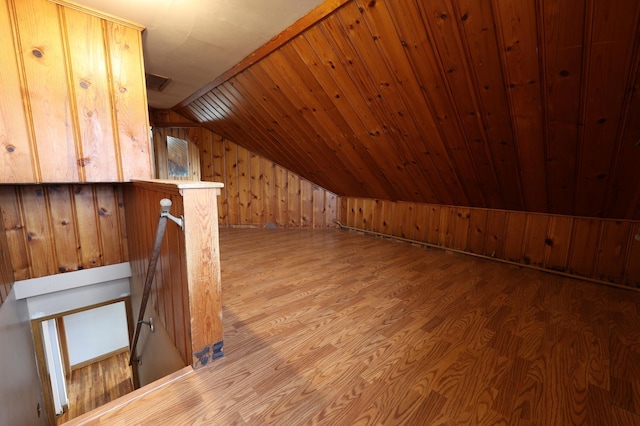 105 2nd St NE, New Prague, MN 56071 - bonus room with wooden walls, lofted ceiling, and wood finished floors