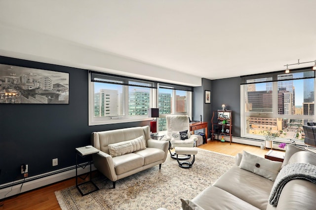 433 7th St Unit 1623, Minneapolis, MN 55415 - living room featuring a baseboard radiator, wood finished floors, and a view of city