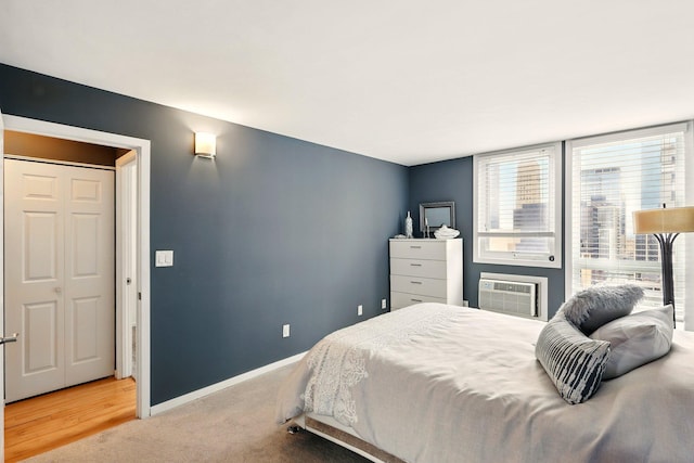 433 7th St Unit 1623, Minneapolis, MN 55415 - bedroom featuring baseboards, carpet, and a wall unit AC