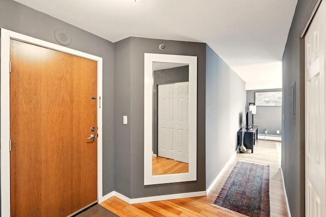 433 7th St Unit 1623, Minneapolis, MN 55415 - foyer with light wood-type flooring, baseboard heating, and baseboards