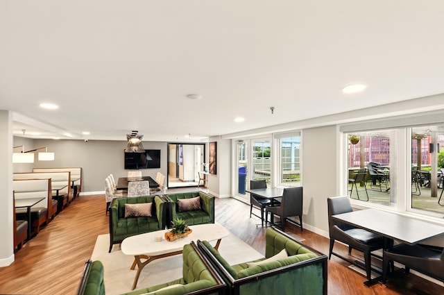 433 7th St Unit 1623, Minneapolis, MN 55415 - living room with baseboards, wood finished floors, and recessed lighting