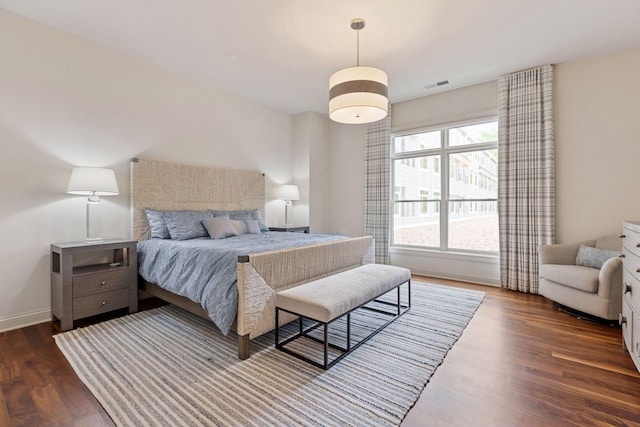 935 Lake St E Unit 211, Wayzata, MN 55391 - bedroom featuring dark wood-type flooring and baseboards