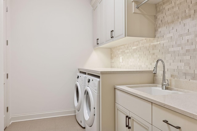 935 Lake St E Unit 211, Wayzata, MN 55391 - laundry area featuring washing machine and dryer and cabinet space