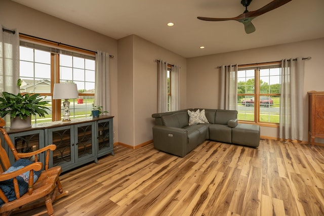 106 9th Ave SE, Kasson, MN 55944 - living area with light wood-style floors, a ceiling fan, baseboards, and recessed lighting