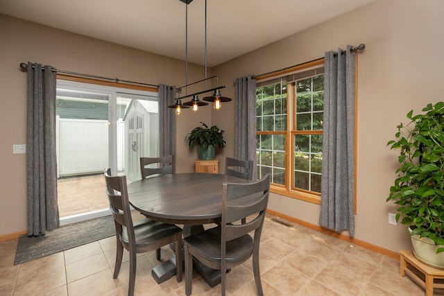 106 9th Ave SE, Kasson, MN 55944 - dining space featuring plenty of natural light, baseboards, and light tile patterned flooring