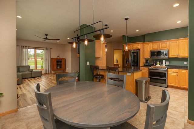 106 9th Ave SE, Kasson, MN 55944 - dining room with recessed lighting, ceiling fan, light tile patterned floors, and baseboards