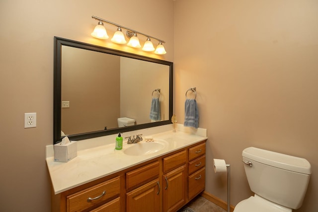 106 9th Ave SE, Kasson, MN 55944 - bathroom with toilet, vanity, and tile patterned flooring