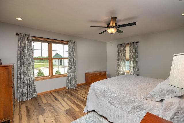 106 9th Ave SE, Kasson, MN 55944 - bedroom featuring multiple windows, wood finished floors, baseboards, a ceiling fan, and recessed lighting