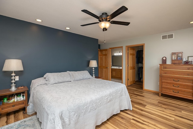 106 9th Ave SE, Kasson, MN 55944 - bedroom with light wood finished floors, baseboards, recessed lighting, a spacious closet, and ceiling fan