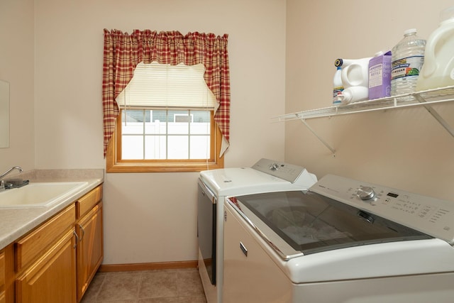 106 9th Ave SE, Kasson, MN 55944 - laundry room featuring washer and dryer, baseboards, light tile patterned floors, and cabinet space