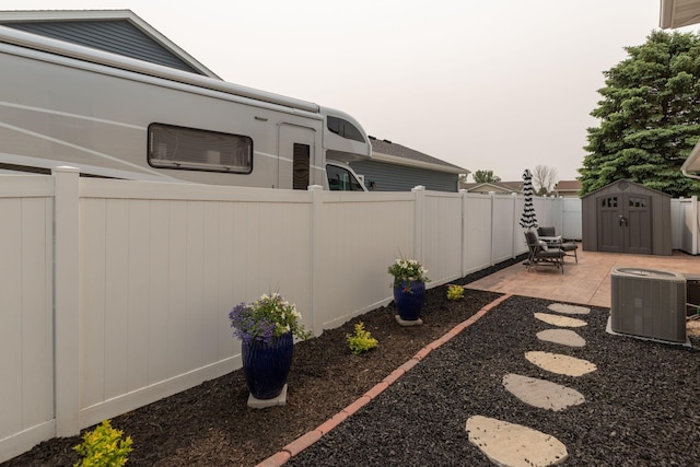 106 9th Ave SE, Kasson, MN 55944 - fenced backyard with cooling unit and a patio area