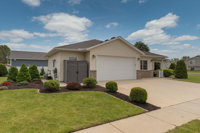 106 9th Ave SE, Kasson, MN 55944 - single story home with an attached garage, driveway, a front yard, and brick siding
