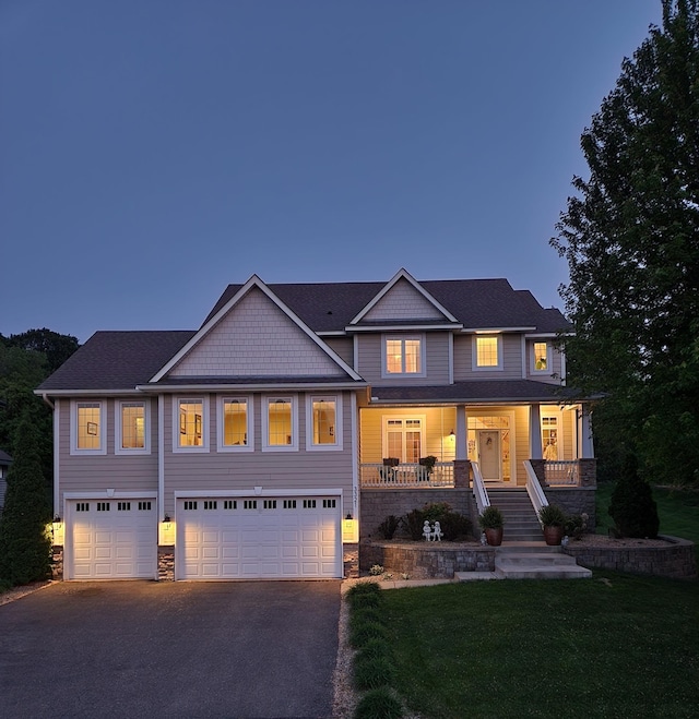 3321 Willie Dr, Burnsville, MN 55337 - craftsman-style house with asphalt driveway, a garage, and stone siding