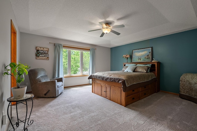 3321 Willie Dr, Burnsville, MN 55337 - carpeted bedroom featuring a textured ceiling, baseboards, ceiling fan, and a raised ceiling