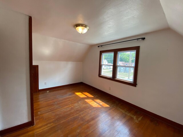 219 9th Ave SE, Rochester, MN 55904 - additional living space featuring lofted ceiling, baseboards, and hardwood / wood-style flooring