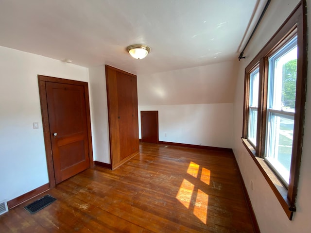 219 9th Ave SE, Rochester, MN 55904 - unfurnished room featuring wood-type flooring and baseboards