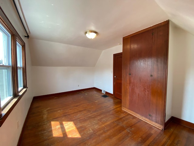 219 9th Ave SE, Rochester, MN 55904 - additional living space featuring dark wood finished floors, lofted ceiling, and baseboards