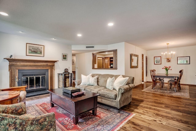 3020 Saint Albans Mill Rd Unit 309, Minnetonka, MN 55305 - living area with wood finished floors, a chandelier, recessed lighting, and a glass covered fireplace