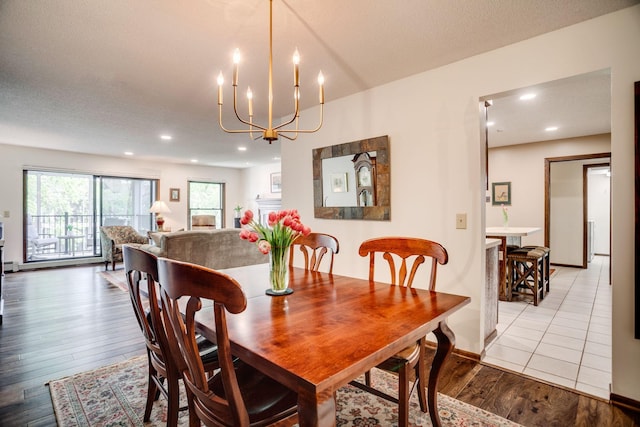 3020 Saint Albans Mill Rd Unit 309, Minnetonka, MN 55305 - dining space featuring light wood finished floors, plenty of natural light, a chandelier, and recessed lighting
