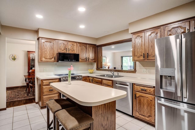 3020 Saint Albans Mill Rd Unit 309, Minnetonka, MN 55305 - kitchen featuring appliances with stainless steel finishes, a sink, light countertops, recessed lighting, and light tile patterned floors