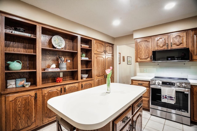 3020 Saint Albans Mill Rd Unit 309, Minnetonka, MN 55305 - kitchen with stainless steel range with electric cooktop, black microwave, light countertops, open shelves, and light tile patterned floors