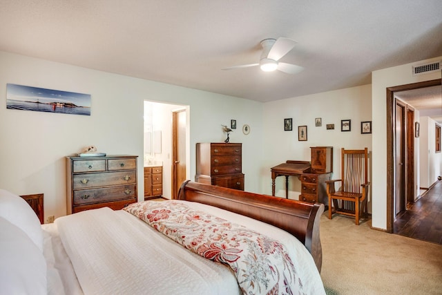 3020 Saint Albans Mill Rd Unit 309, Minnetonka, MN 55305 - bedroom featuring dark colored carpet, a ceiling fan, and ensuite bathroom