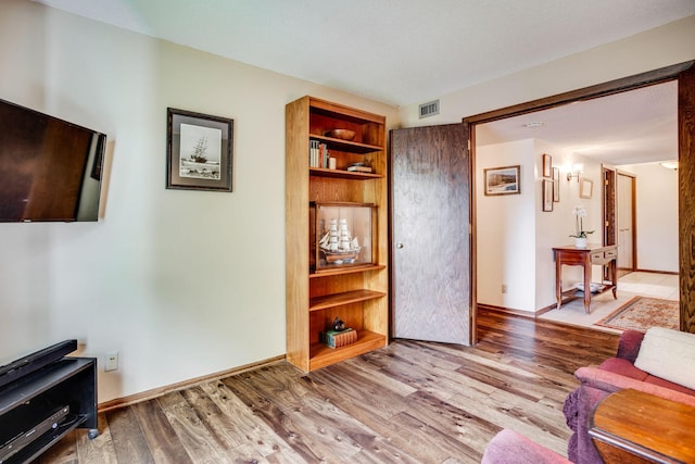 3020 Saint Albans Mill Rd Unit 309, Minnetonka, MN 55305 - sitting room with wood finished floors and baseboards