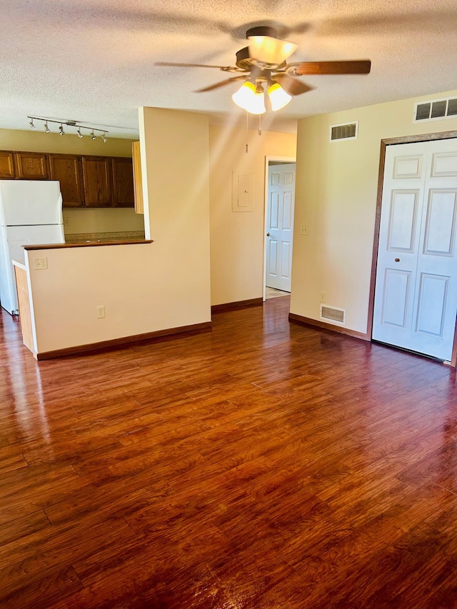 3333 Nevada Ave N Unit 3302, Crystal, MN 55427 - unfurnished living room with ceiling fan, a textured ceiling, dark wood-style flooring, and baseboards