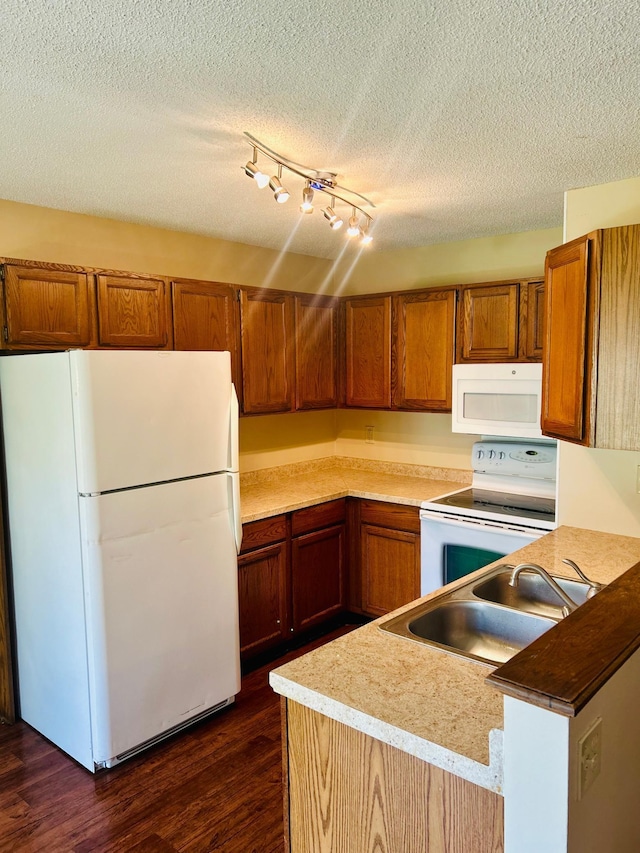 3333 Nevada Ave N Unit 3302, Crystal, MN 55427 - kitchen with white appliances, a sink, brown cabinets, a textured ceiling, and dark wood-style floors