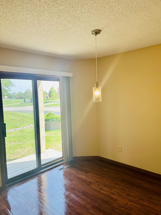 3333 Nevada Ave N Unit 3302, Crystal, MN 55427 - unfurnished dining area with dark wood-type flooring and a textured ceiling