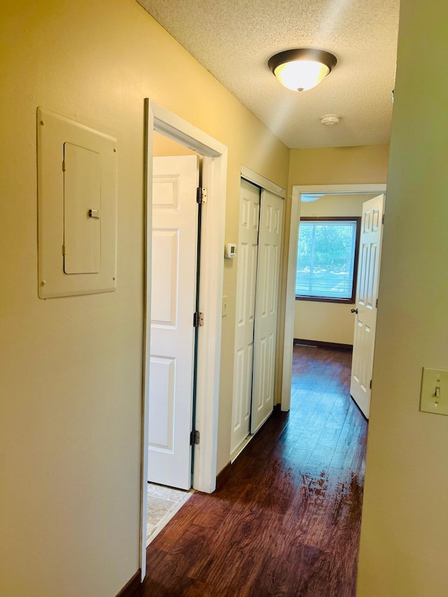 3333 Nevada Ave N Unit 3302, Crystal, MN 55427 - hall featuring electric panel, wood finished floors, a textured ceiling, and baseboards